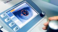 Corneal topographer with an eye and cornea displaying on the screen
